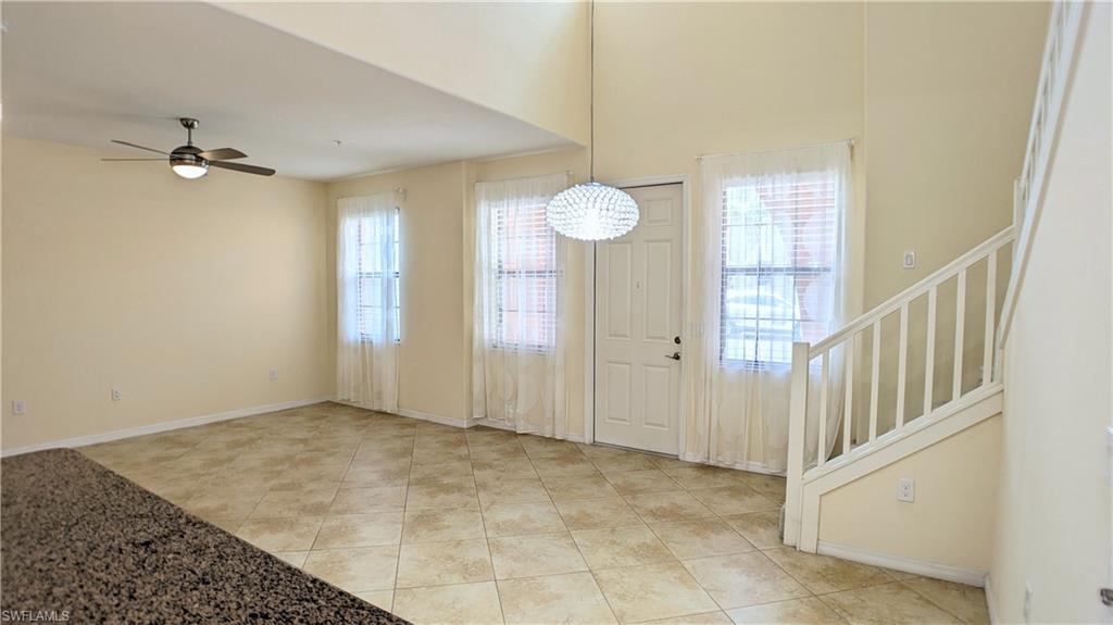 9067 Capistrano Street North, Unit 4503 Naples, FL 34113 - Photo 9 of 41 an empty room with windows and fan