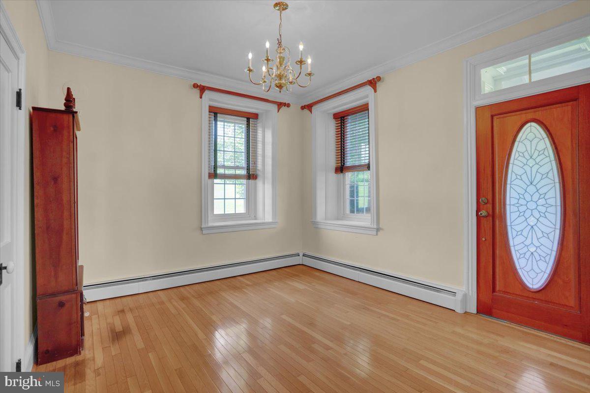 739 Boar Road Mohrsville, PA 19541 - Photo 12 of 98 a view of an empty room with window and wooden floor