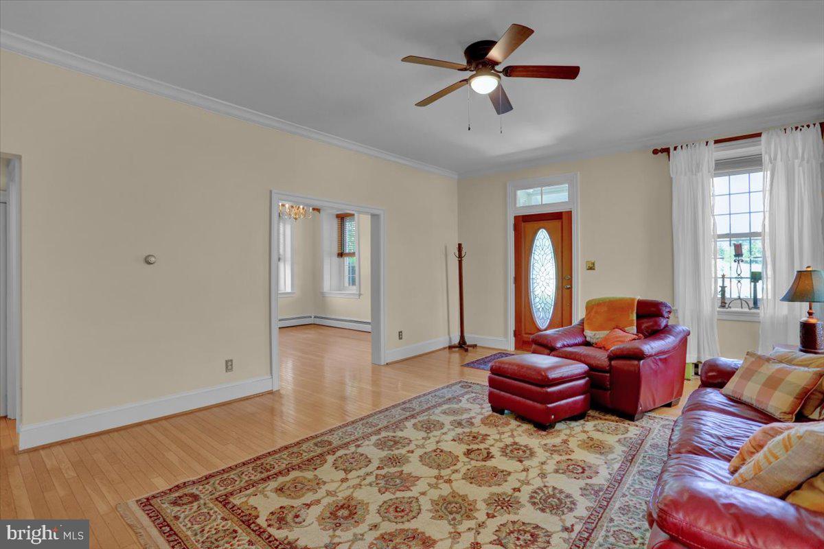 739 Boar Road Mohrsville, PA 19541 - Photo 13 of 98 a living room with furniture ceiling fan and a rug