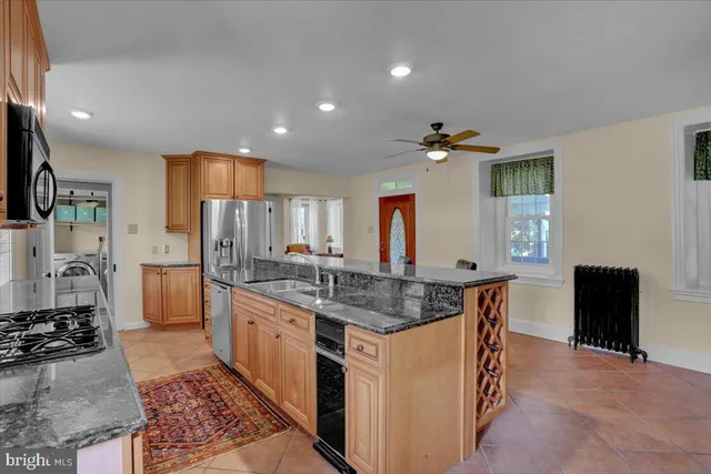 an aerial view of a house with swimming pool garden and mountain view