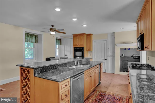 a kitchen with a stove a sink and a refrigerator
