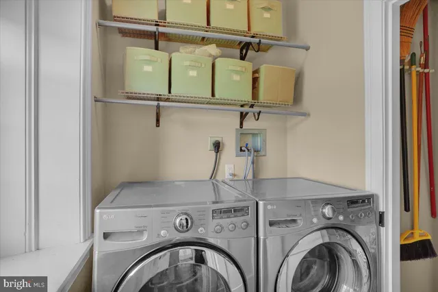 a kitchen with stainless steel appliances granite countertop a sink and dishwasher a stove top oven with white cabinets