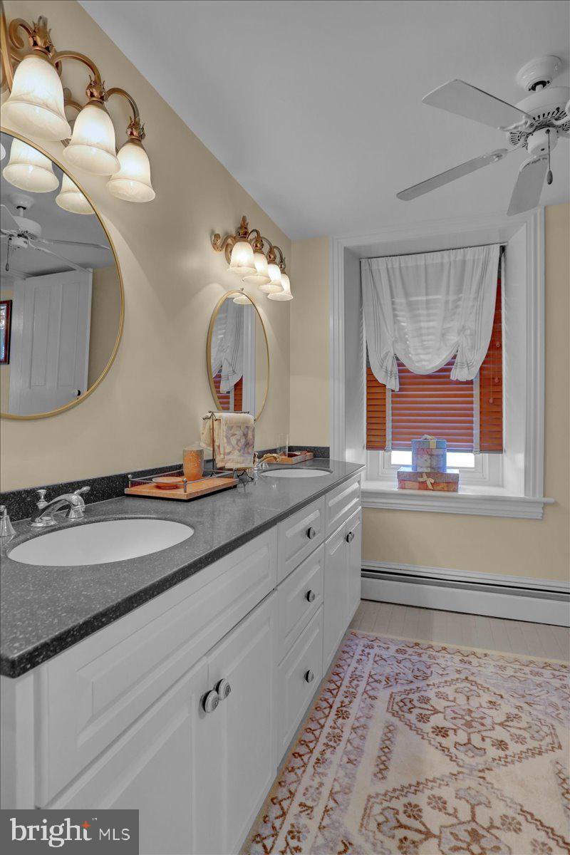 739 Boar Road Mohrsville, PA 19541 - Photo 24 of 98 a bathroom with a sink and a mirror