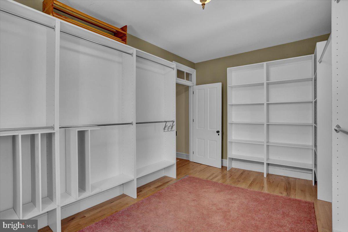 739 Boar Road Mohrsville, PA 19541 - Photo 31 of 98 a view of an empty room with wooden floor and a window