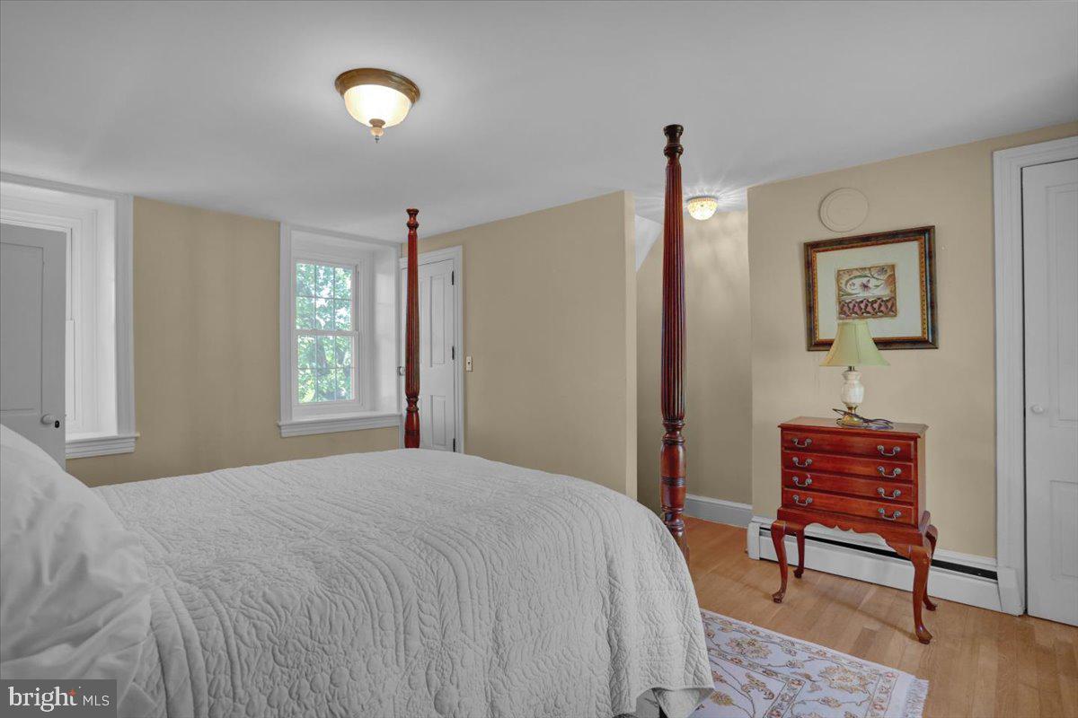 739 Boar Road Mohrsville, PA 19541 - Photo 34 of 98 a bedroom with a bed and a dresser next to a window