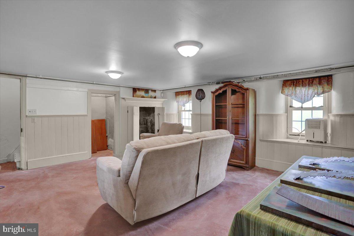 739 Boar Road Mohrsville, PA 19541 - Photo 37 of 98 a living room with furniture and a floor to ceiling window
