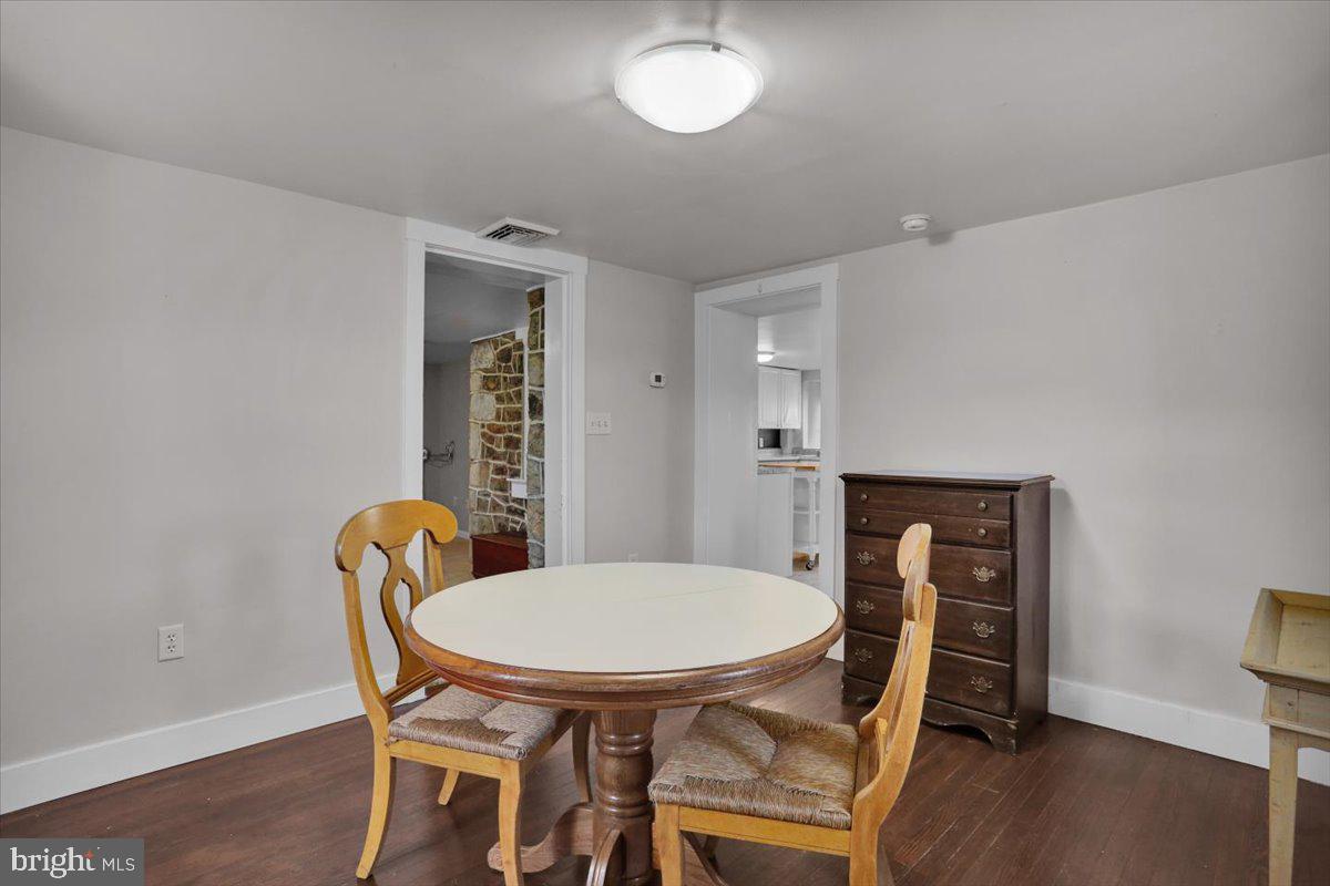 739 Boar Road Mohrsville, PA 19541 - Photo 68 of 98 a view of a dining room with furniture and wooden floor