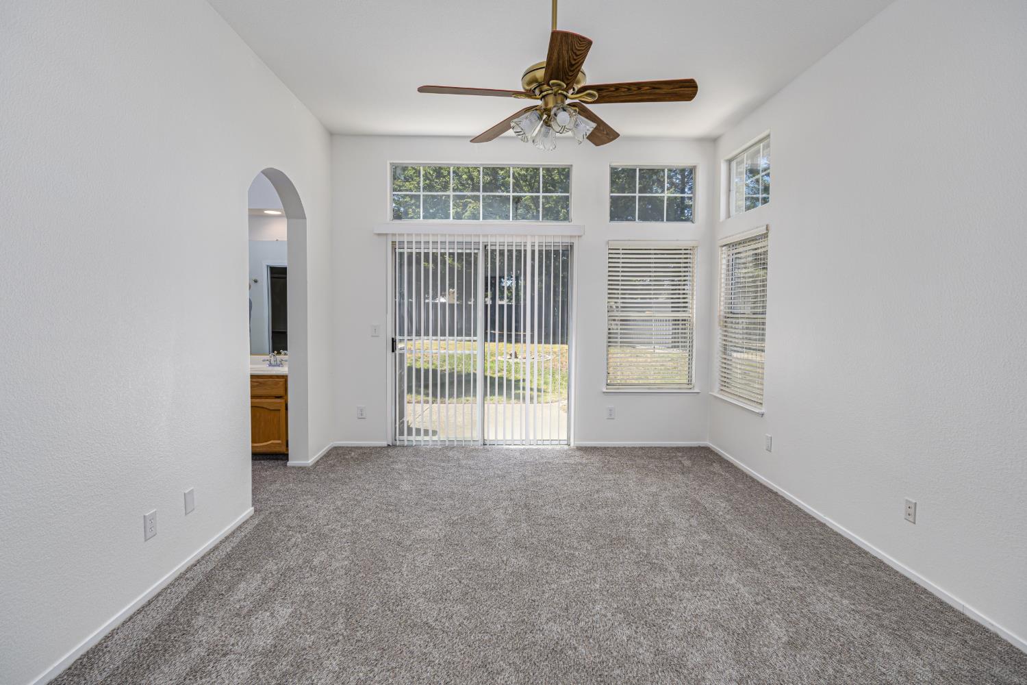 9282 Dever Circle Elk Grove, CA 95624 - Photo 24 of 38 BEDROOM 1 WITH EN SUITE BATHROOM AND SLIDER DOORS TO THE REAR PATIO