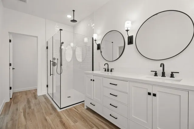 a picture of a bathroom with a sink and a mirror
