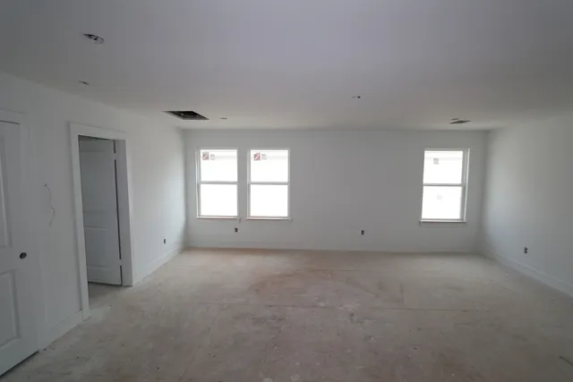 a view of a backyard of the house