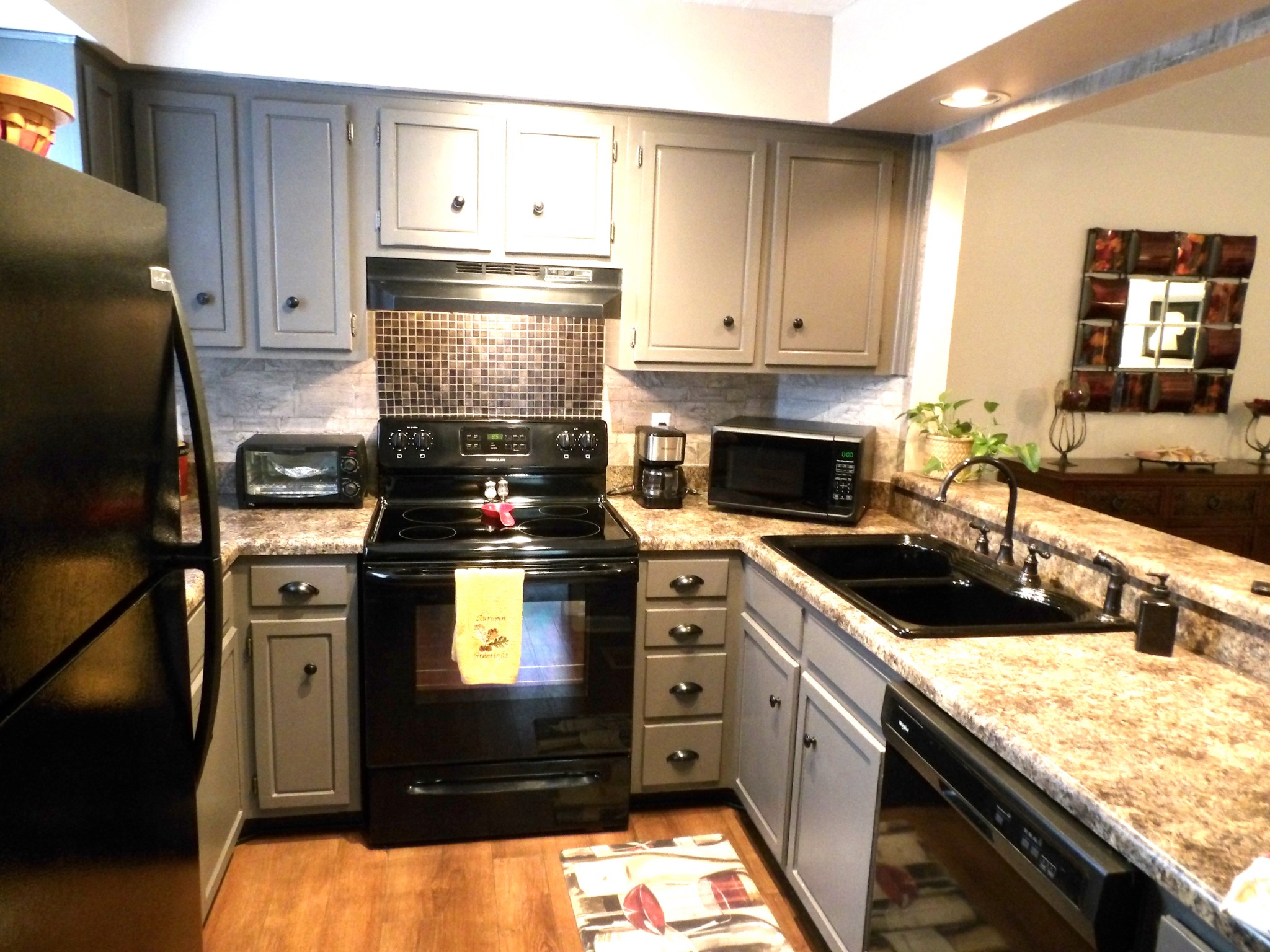 4932 Yorkshire Road Nashville, TN 37211 - Photo 11 of 33 a kitchen with stainless steel appliances granite countertop a stove a sink and a refrigerator