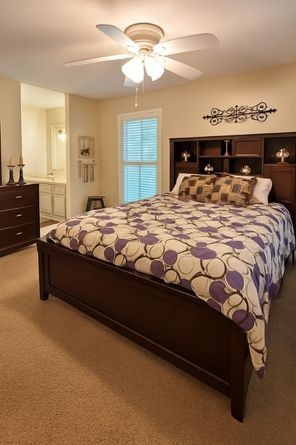 4932 Yorkshire Road Nashville, TN 37211 - Photo 17 of 33 a bed sitting in a bedroom next to a window