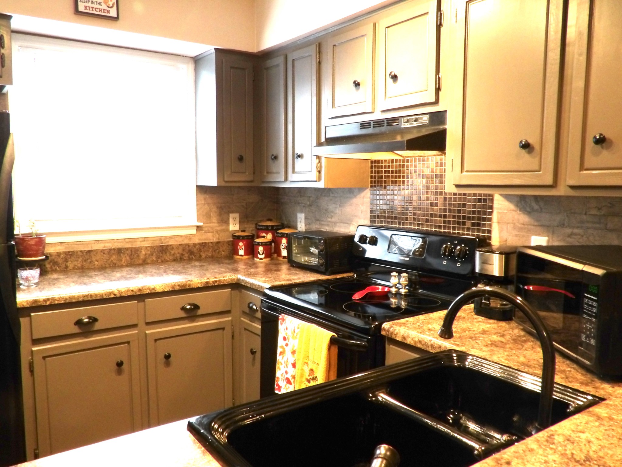 4932 Yorkshire Road Nashville, TN 37211 - Photo 8 of 33 a kitchen with stainless steel appliances granite countertop a sink stove and cabinets