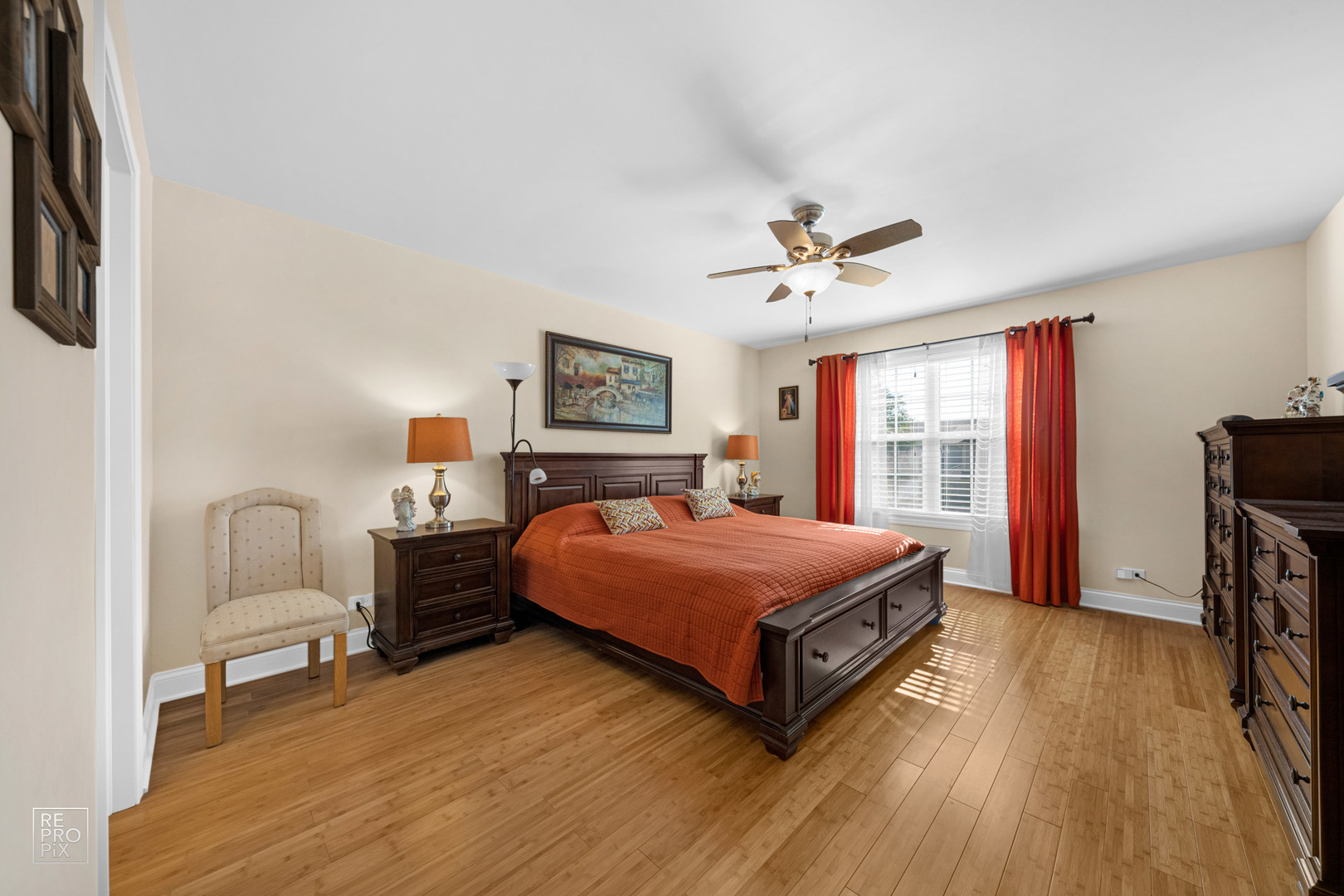 Undisclosed Address Elgin, IL 60120 - Photo 14 of 22 a bedroom with a bed and a chandelier