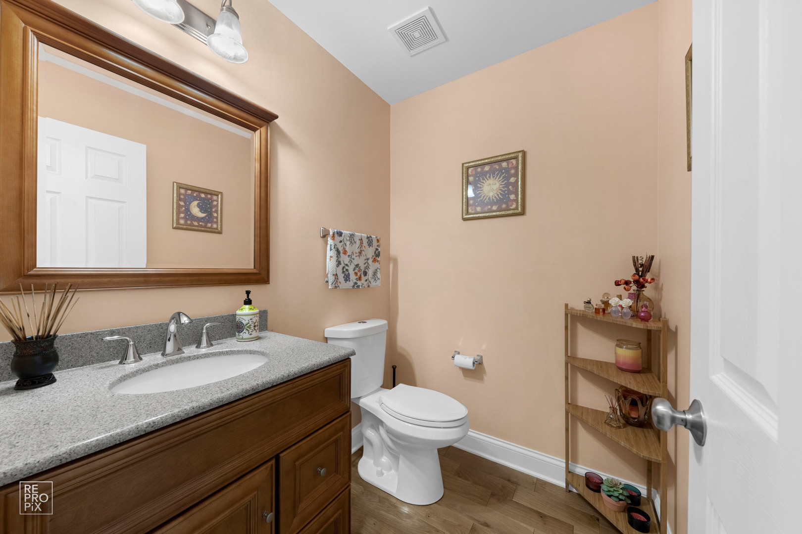 Undisclosed Address Elgin, IL 60120 - Photo 15 of 22 a bathroom with a granite countertop toilet sink and mirror