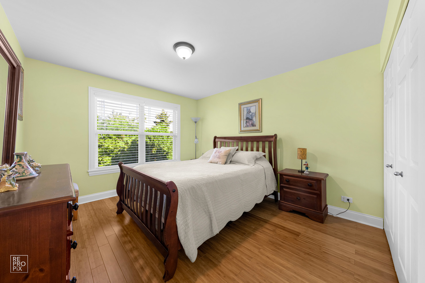 Undisclosed Address Elgin, IL 60120 - Photo 18 of 22 a bedroom with a bed and a window