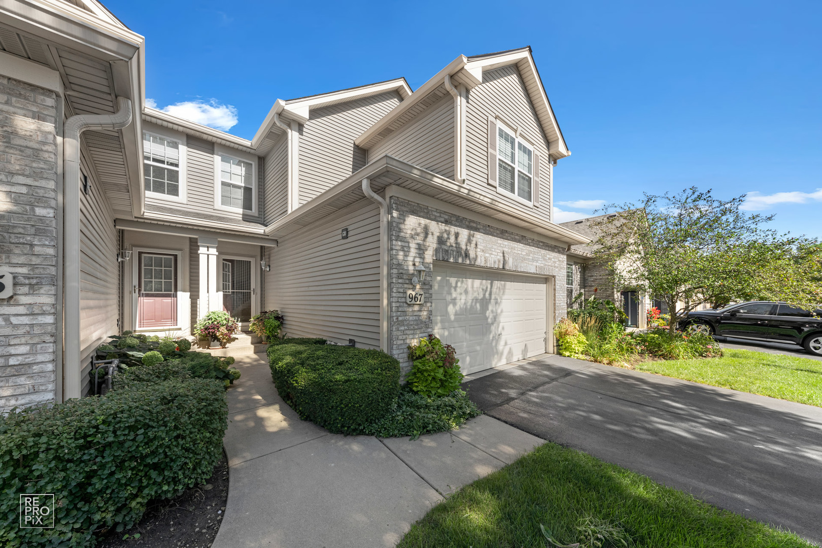 Undisclosed Address Elgin, IL 60120 - Photo 2 of 22 a view of a house with a yard and plants