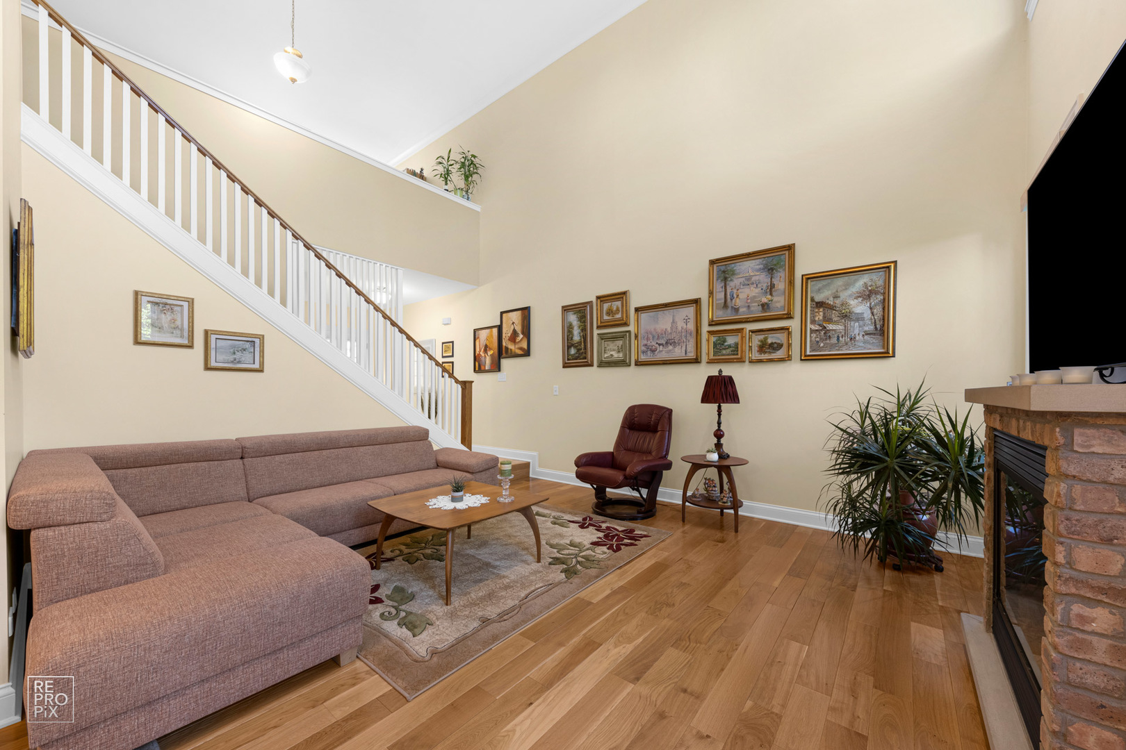 Undisclosed Address Elgin, IL 60120 - Photo 7 of 22 a living room with furniture and a flat screen tv