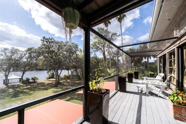 a view of a backyard with sitting area