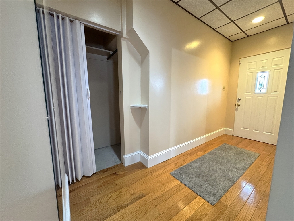 22 Dana Street, Unit 1 Somerville, MA 02145 - Photo 2 of 22 a view of hallway with wooden floor
