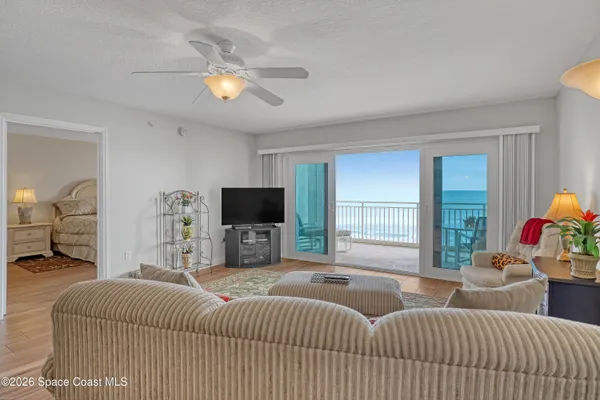 a bedroom with a bed and a television