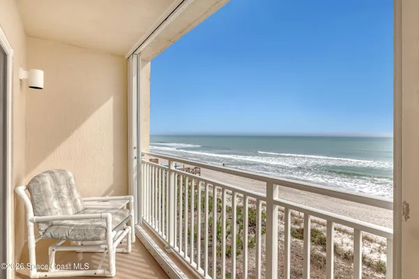 a view of balcony with furniture
