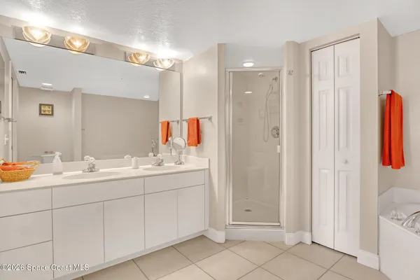 a bathroom with a bathtub and shower