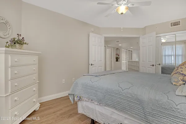 an empty room with a wooden cabinet