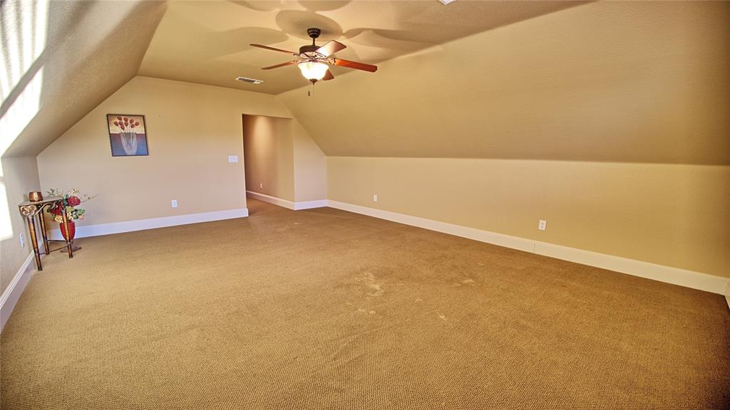 202 Storey Road Nocona, TX 76255 - Photo 13 of 40 view of a big room with carpet