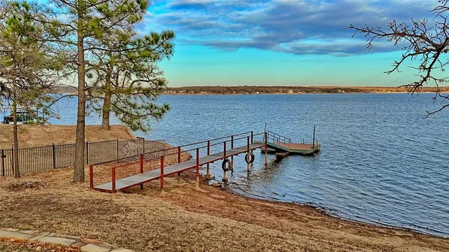 a view of a terrace with wooden floor and lake view
