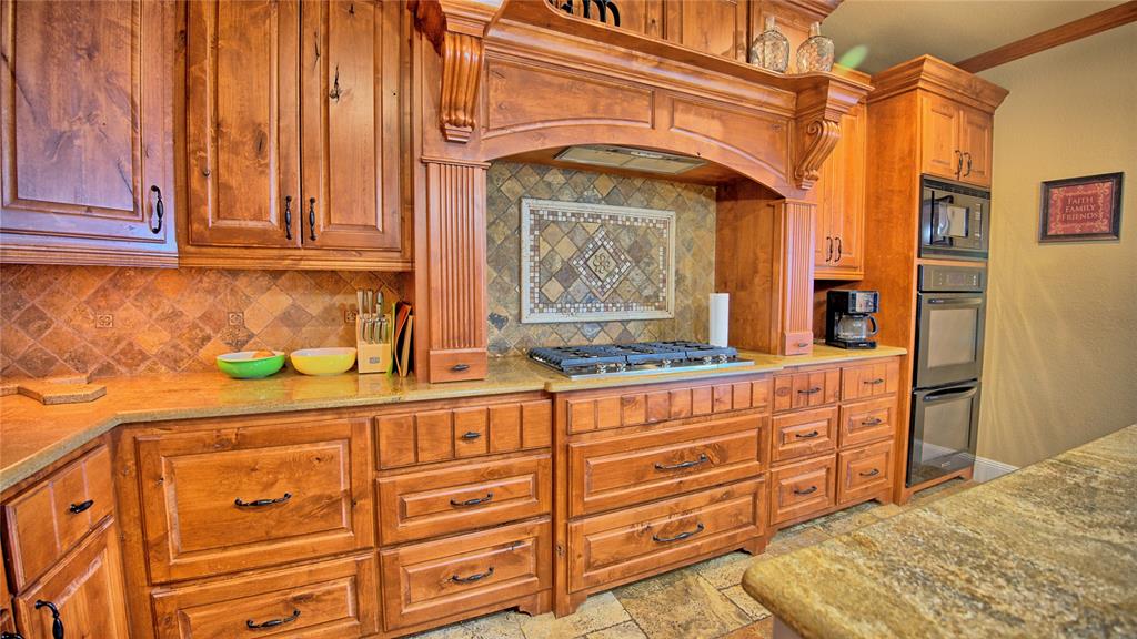 202 Storey Road Nocona, TX 76255 - Photo 17 of 40 a bathroom with a sink a vanity and a mirror