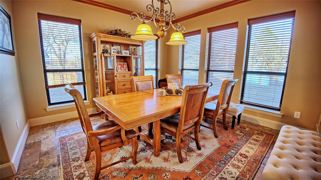 202 Storey Road Nocona, TX 76255 - Photo 23 of 40 a dining room with furniture and window