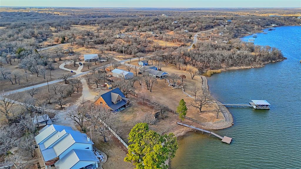 202 Storey Road Nocona, TX 76255 - Photo 26 of 40 an aerial view of a house with a yard