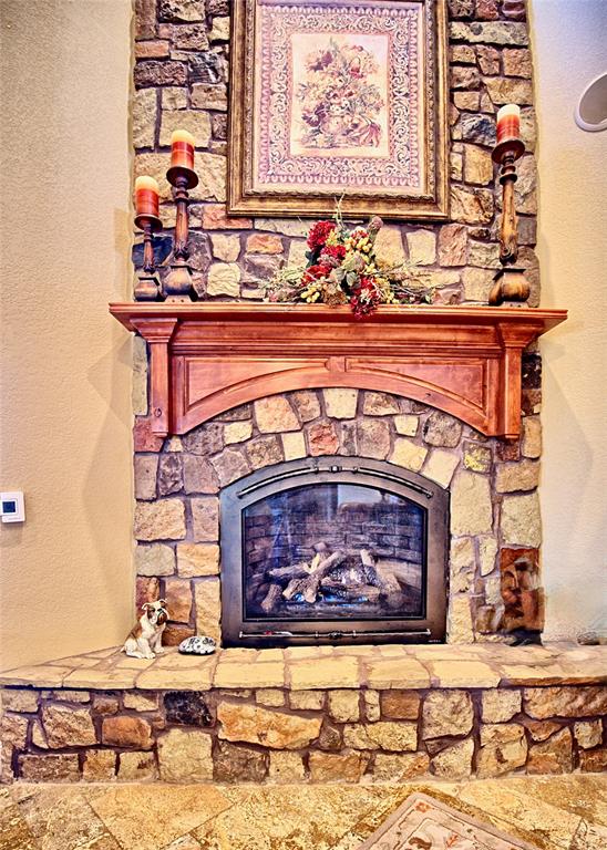 202 Storey Road Nocona, TX 76255 - Photo 27 of 40 a living room with a fireplace