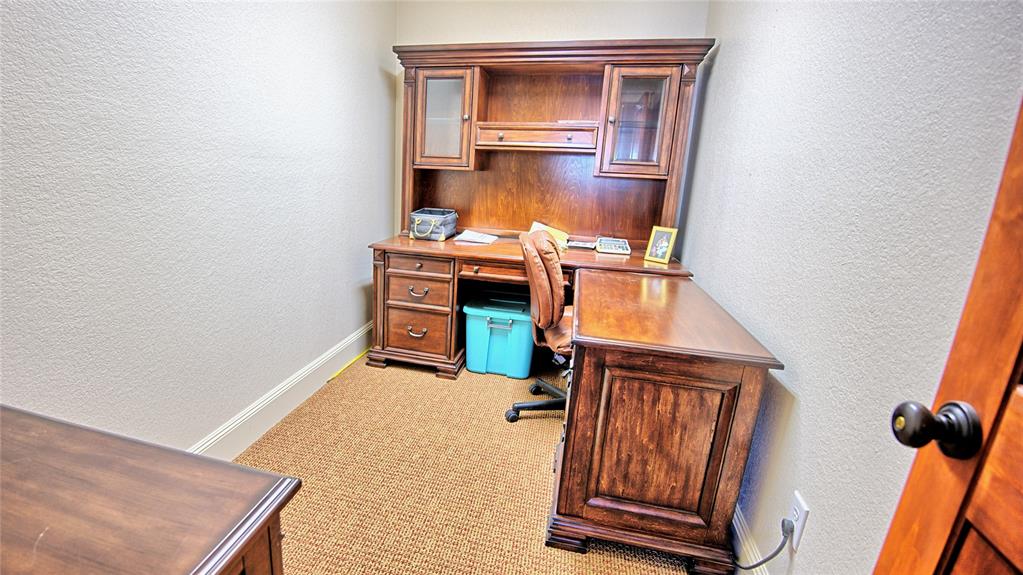 202 Storey Road Nocona, TX 76255 - Photo 29 of 40 a view of an empty room with wooden floor and a window