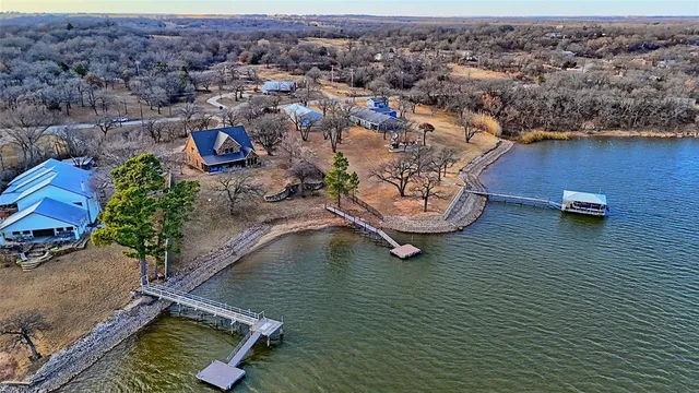 an aerial view of a house with a ocean view