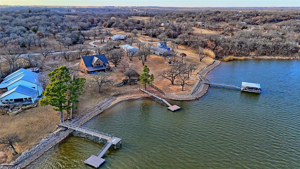 202 Storey Road Nocona, TX 76255 - Photo 33 of 40 an aerial view of a house with a ocean view