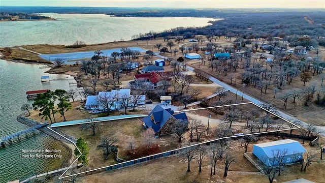 an aerial view of a house with a ocean view