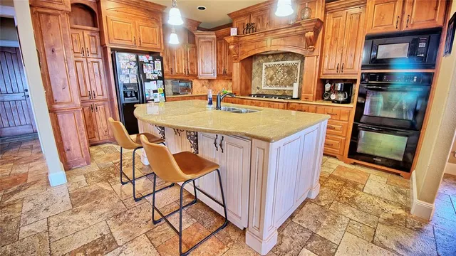 a view of a kitchen with furniture and a fireplace