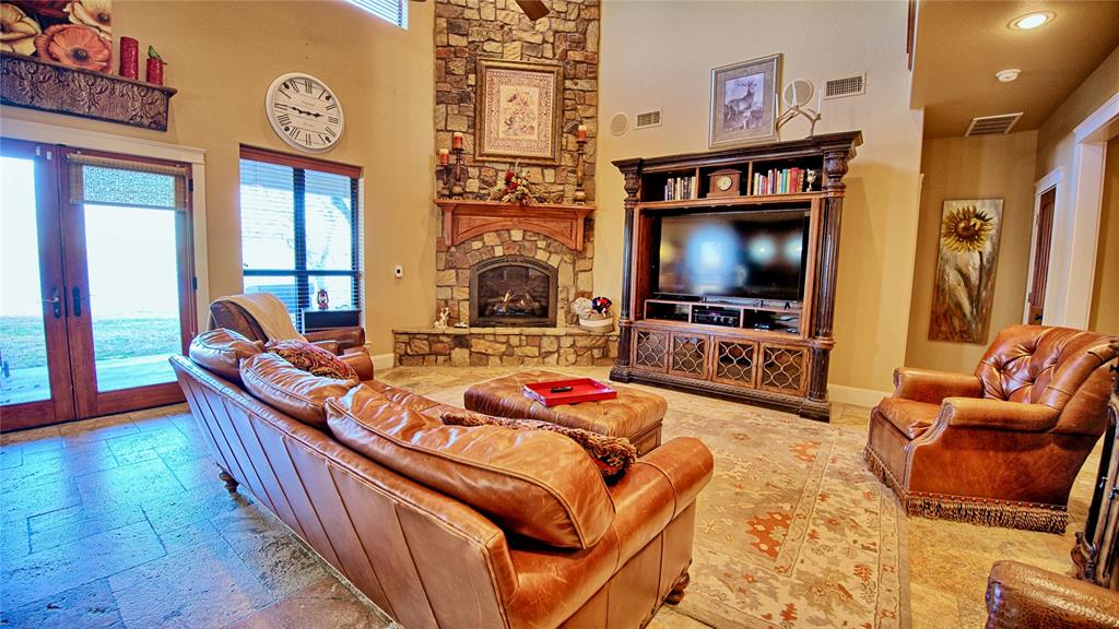 202 Storey Road Nocona, TX 76255 - Photo 6 of 40 a living room with furniture and a flat screen tv