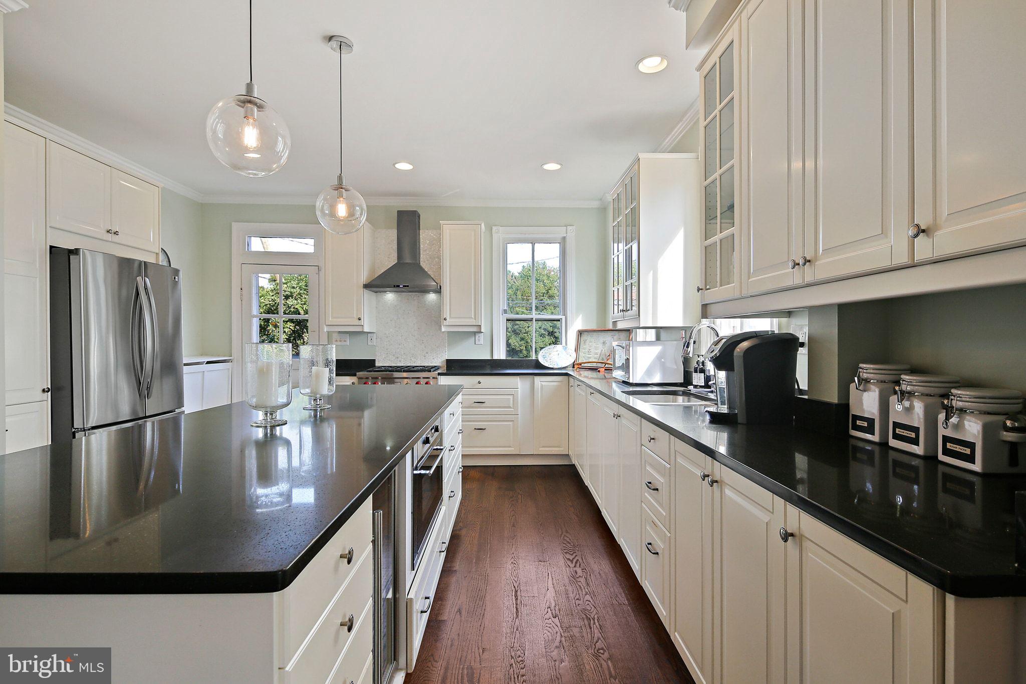32 East Street Annapolis, MD 21401 - Photo 16 of 34 a kitchen with stainless steel appliances granite countertop a sink a stove and refrigerator