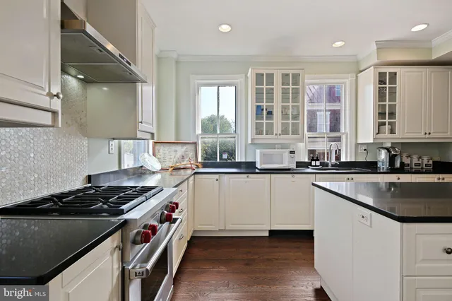 a kitchen with a stove and a sink