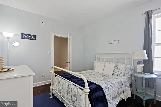 a bedroom with a bed and a table