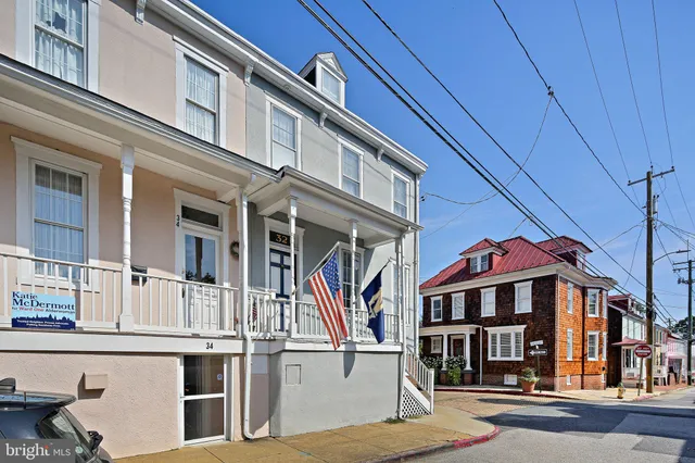 a front view of a residential apartment building with a street