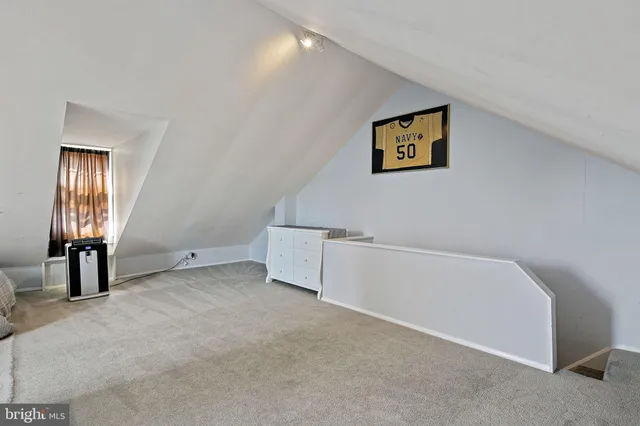 a view of an empty room with windows