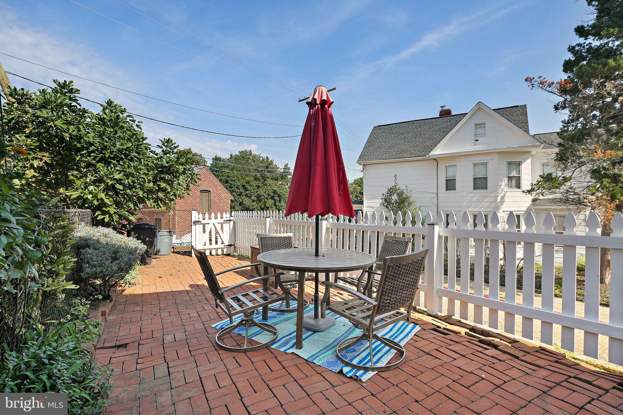 32 East Street Annapolis, MD 21401 - Photo 32 of 34 a view of a chairs and table in patio with a fire pit