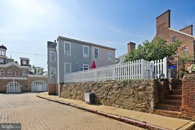 a view of a brick house front of building