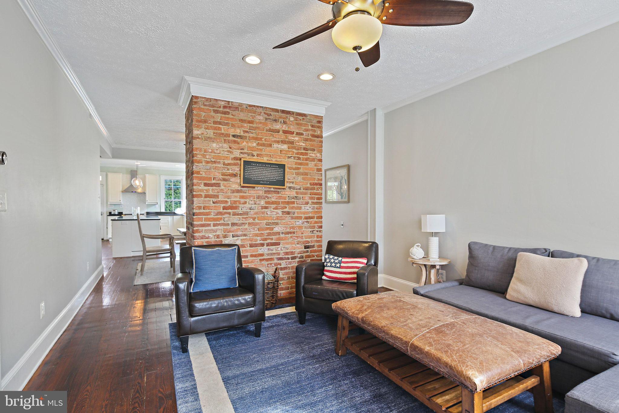 32 East Street Annapolis, MD 21401 - Photo 7 of 34 a living room with furniture and a fireplace