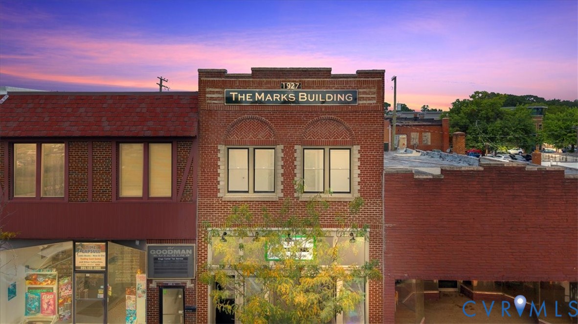a view of a building with a street