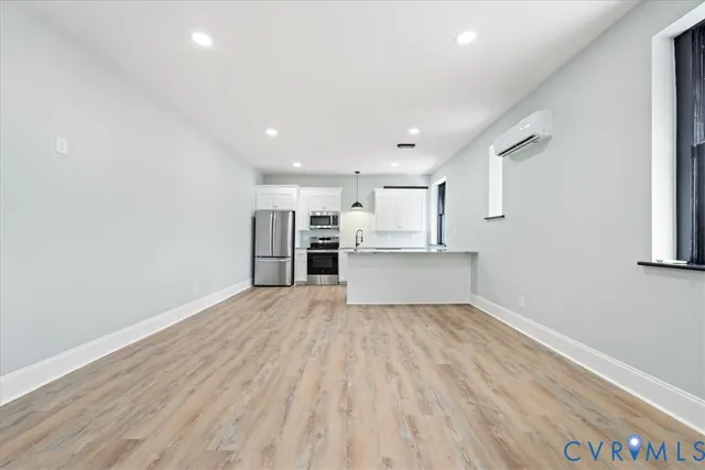 a view of kitchen with wooden floor